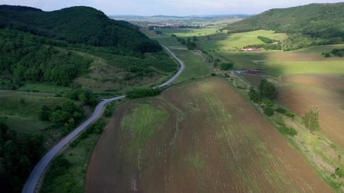 Stunning landscapes with winding road and mountains on the side.