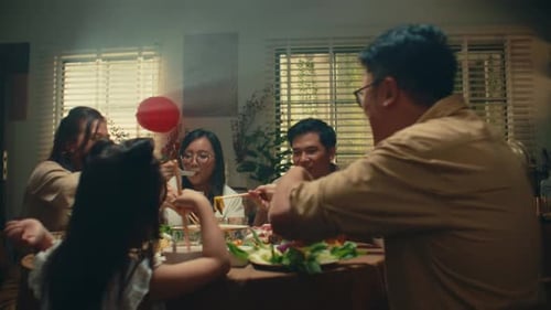 Family Meal with Chopsticks at Indoor Table