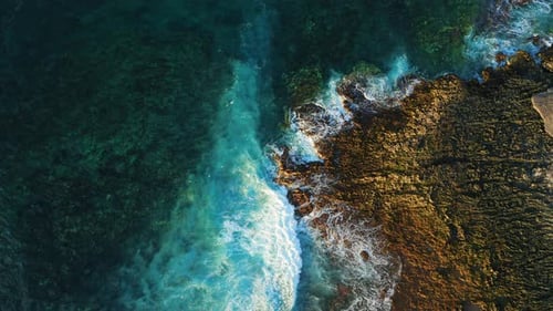 Ocean Waves Crash on Rocky Shore Volcanic Beach