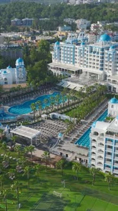 Vertical Video Mediterranean Luxury Hotel with Sparkling Pools Pristine Beaches and Stunning Hotel