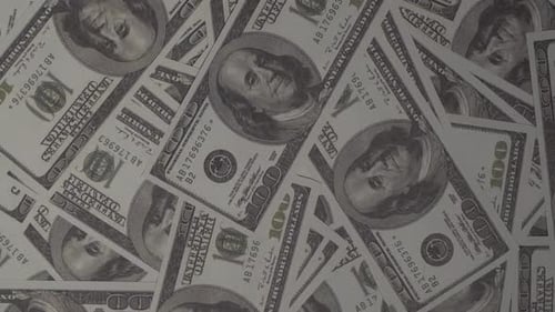 Close-Up View of Scattered Hundred Dollar Bills