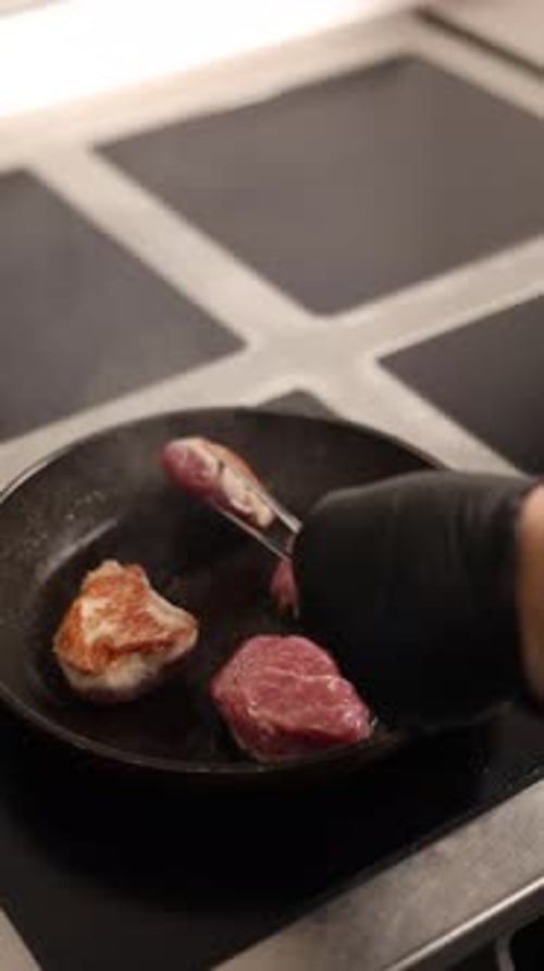 Meat Cooking in Pan on Stove