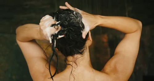 Woman Shampooing Hair in the Shower