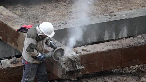 Angular Saw Grinding Through Construction Piles at Construction Site