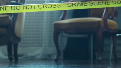 Crime Scene Interior with Evidence Markers and Tape