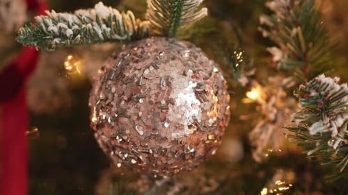 Shimmering Christmas Bauble Hanging on Festive Christmas Tree