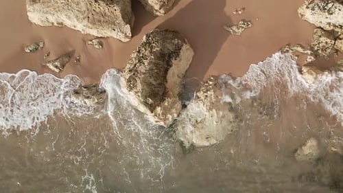 Waves and Rocks in Motion