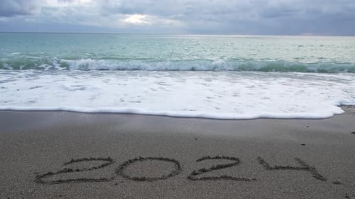 Happy New Year 2025 Hand Written Digit 2024 Washed By Wave on the Sea Beach Abstract Background of
