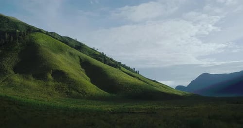 Aerial Drone Footage of Green Hills in Bromo Mountain Area