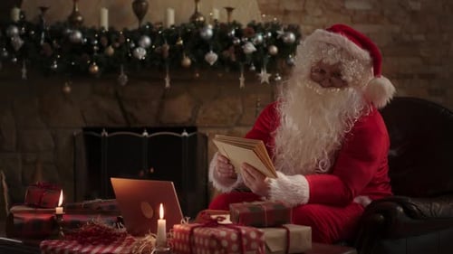 Santa Claus Reads Letters by the Fireplace