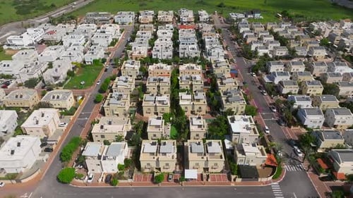 Suburban neighborhood homes with small private yards, typical middle class housing, Aerial view