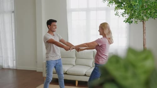 Happy Couple Dancing Together at Home