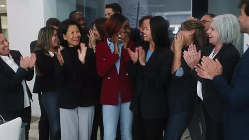 Group of multigenerational business team celebrating success in the office