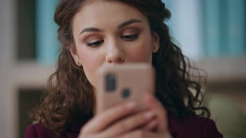 Woman Using Mobile Phone in Close Up Shot