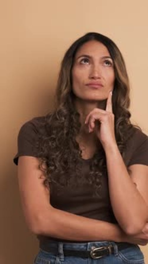 Thoughtful Woman Contemplating a Clever Idea