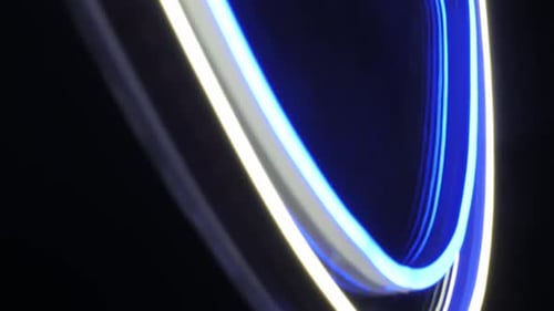 Blue and White LED Ring Light Ornament Glowing in Dark - Futuristic Detail View