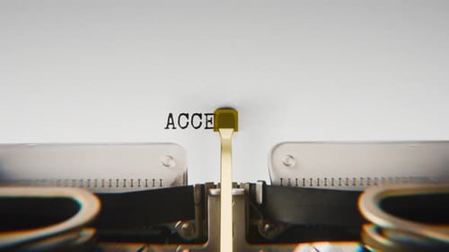 Old mechanical typewriter typing Accessibility in a close-up view.