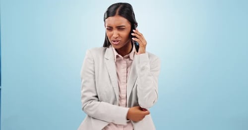 Phone call, argument and business woman in a studio with moody, upset and angry expression