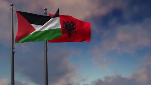 Palestine and Albania Flags Waving Together against Blue Sky