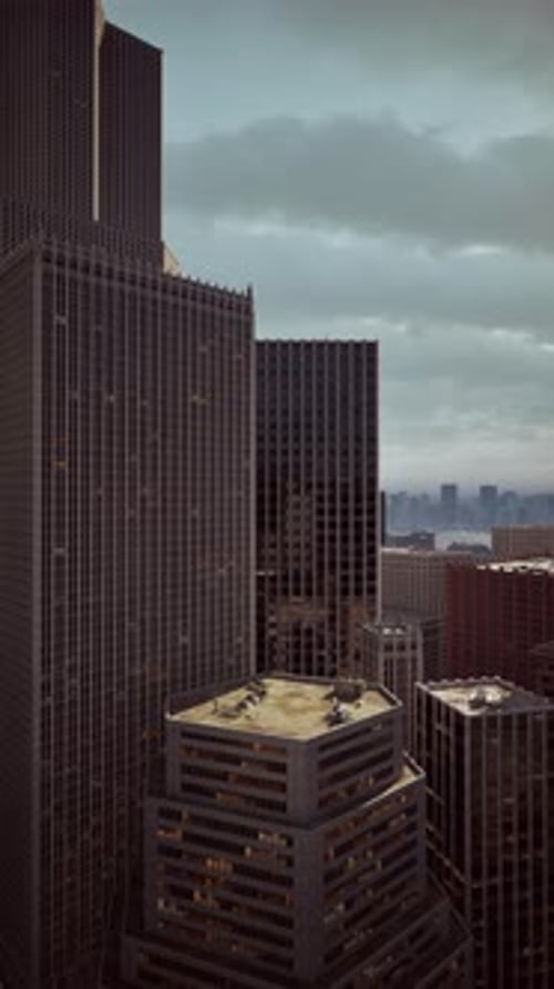 Vertical Time-Lapse of Clouds Moving Over City Skyscrapers