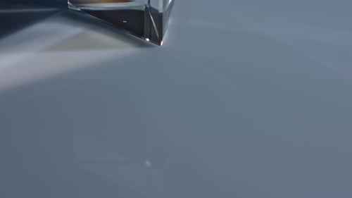 Light Refracting Through Prism Creating Rainbow