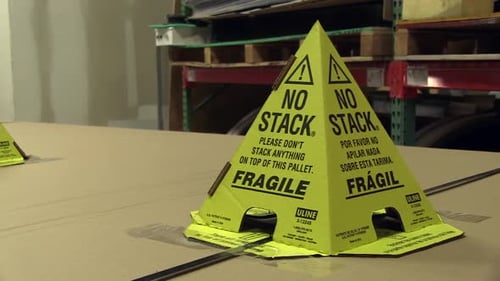 Pallet with No Stack Warning Signs in Warehouse