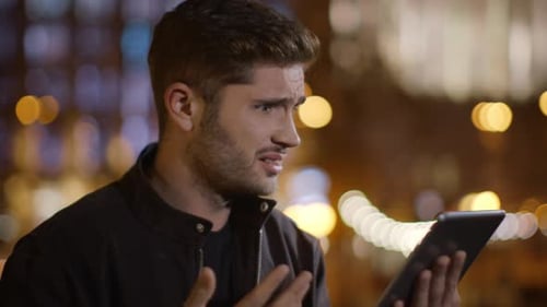 Portrait of Disappointed Man Getting Message on Tablet Computer Outdoor. Closeup Sad