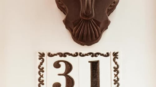 Number 31 (thirty-one) Affixed to a Building