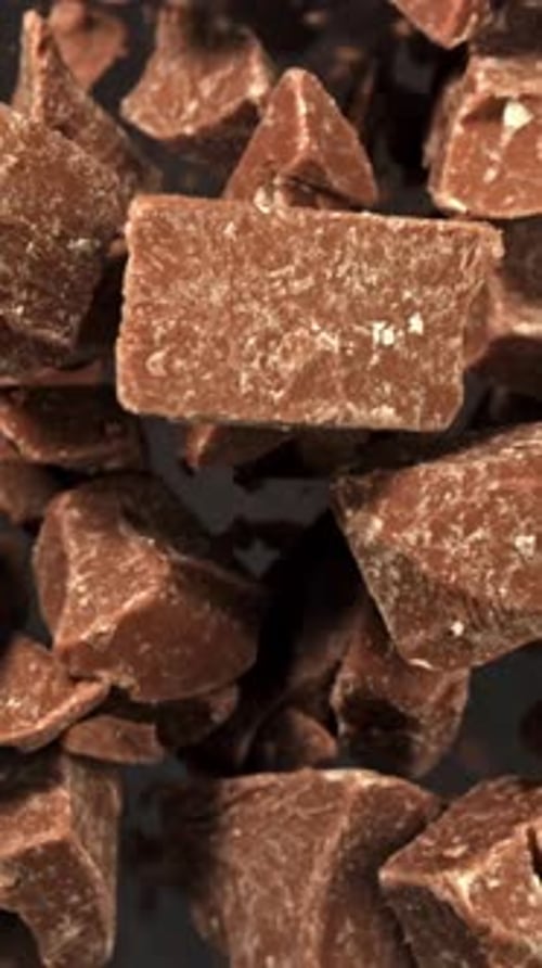 Super Slow Motion Pieces of Dark Milk Chocolate Filmed on a Highspeed Camera at 1000 Fps