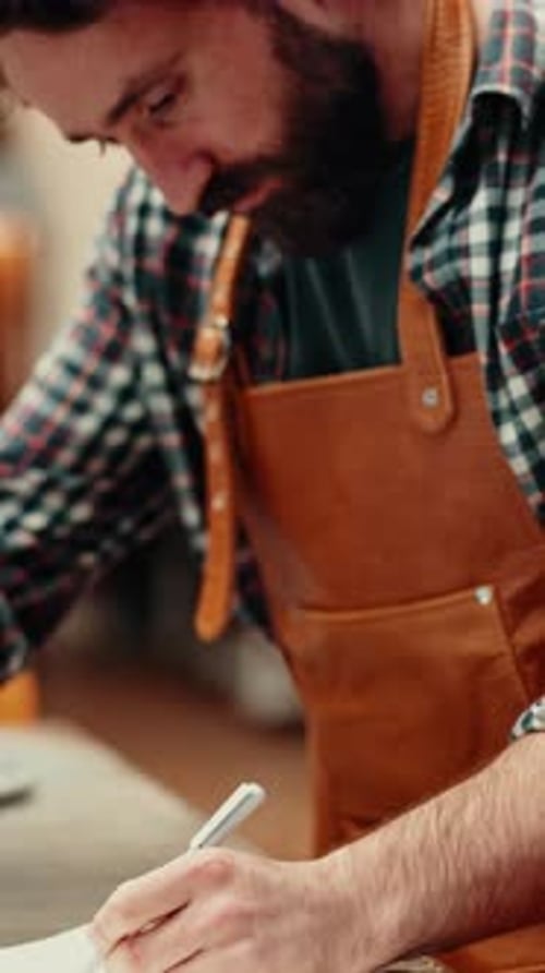 Carpentry, review or man in warehouse with notes, order preparation or inventory management