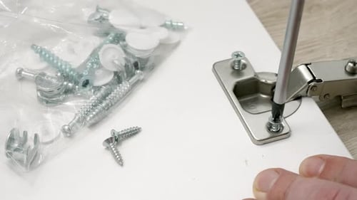 Attaching Hinge with Screwdriver Close Up Shot