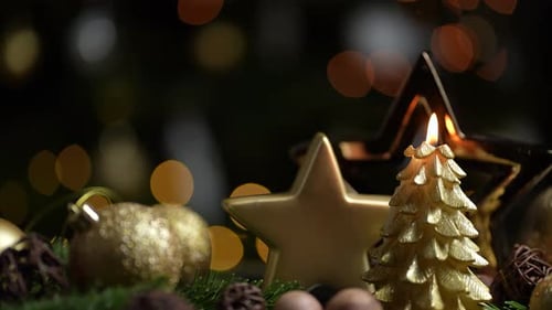 Christmas Decorations with Candlelight and Golden Ornaments