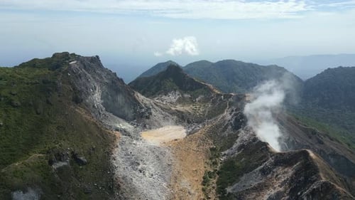 Beautiful Mount Sibayak volcano, natural active caldera steaming. Aerial drone view of Berastagi, Su