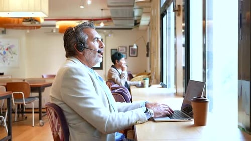 Professional Man Working on Laptop in Coworking Space