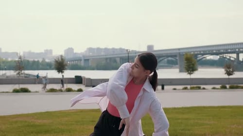 Girl Dancer Dancing Energetic Dance on the Street in Urban Atmosphere