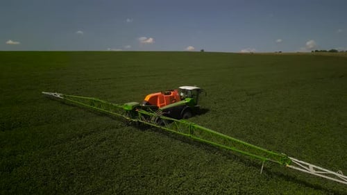 Spray Fertilize On Field With Chemicals In Agriculture Field