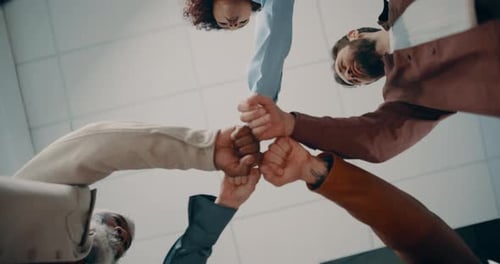 Creative, people and meeting with fist bump in office for teamwork, agreement and motivation