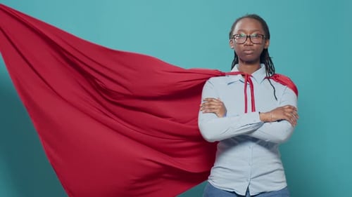 Woman Superhero Posing with Arms Crossed in Studio