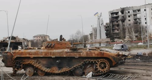Damaged Tank Sits Amidst Urban Destruction