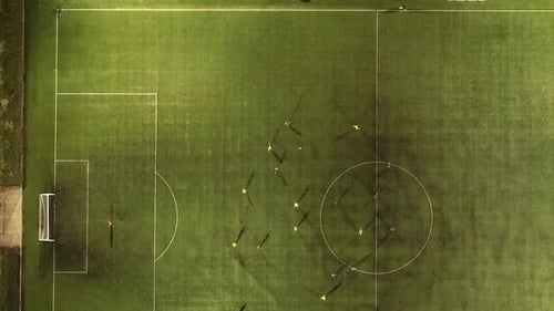 Drone aerial tracking of football from high angle view as the ball moves around the pitch and finall