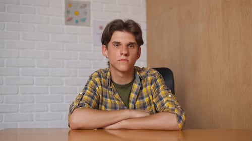 Man College Student Studying at Home Pov Sitting at Desk Listening Watching Lesson Online on
