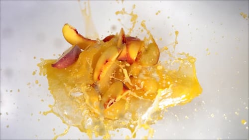 Super Slow Motion of Explosion Peach and Burst Juice and Slices
