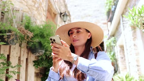 Portrait View of Young Caucasian Beautiful Woman Using Phone Taking Pictures Looking at Interesting
