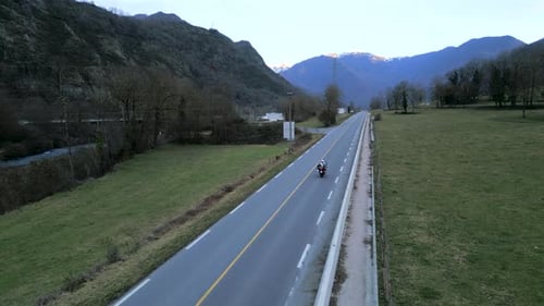 Vehicles Travel Rural Mountain Road in Overcast Weather