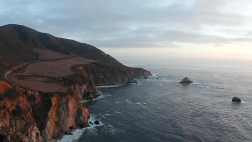 Aerial View Of Big Sur Rugged Cliffs And Seascape During Sunset In California, USA.