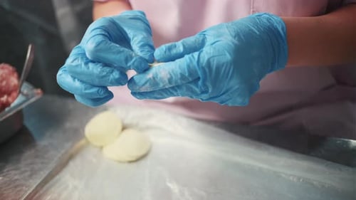 Food Service Worker Forming a Dumpling Close Up