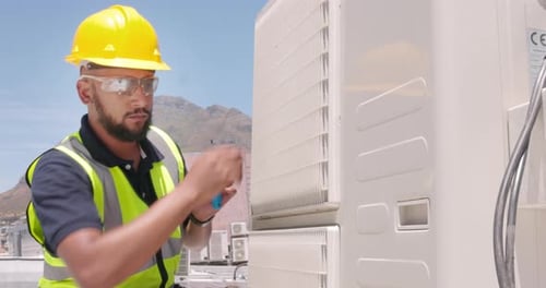 Technician man on roof for air conditioner, generator or ac repair maintenance