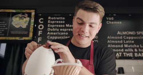 Barista Carefully Brewing Pour Over Coffee at Cafe
