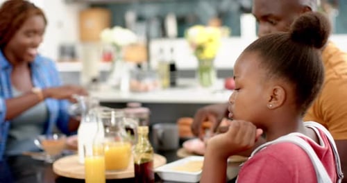 Family Enjoying Breakfast Together at Home