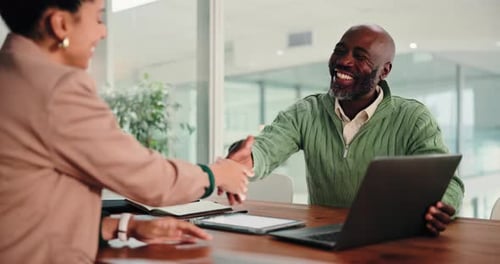 Successful Business Meeting with Handshake in Modern Office